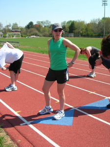 Sue at She Does Tri camp track workout